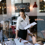 Smiling collaborator attending diners